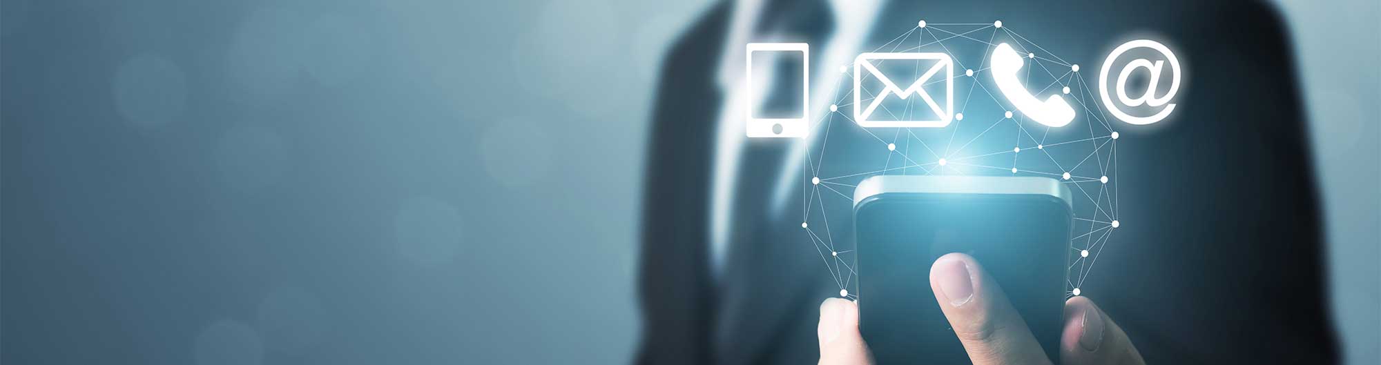 hand holding mobile capable of phone email and messaging