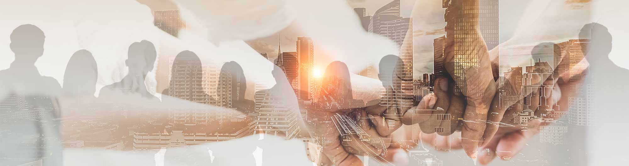 Corporate Team Concept with united hands, silhouettes, and buildings